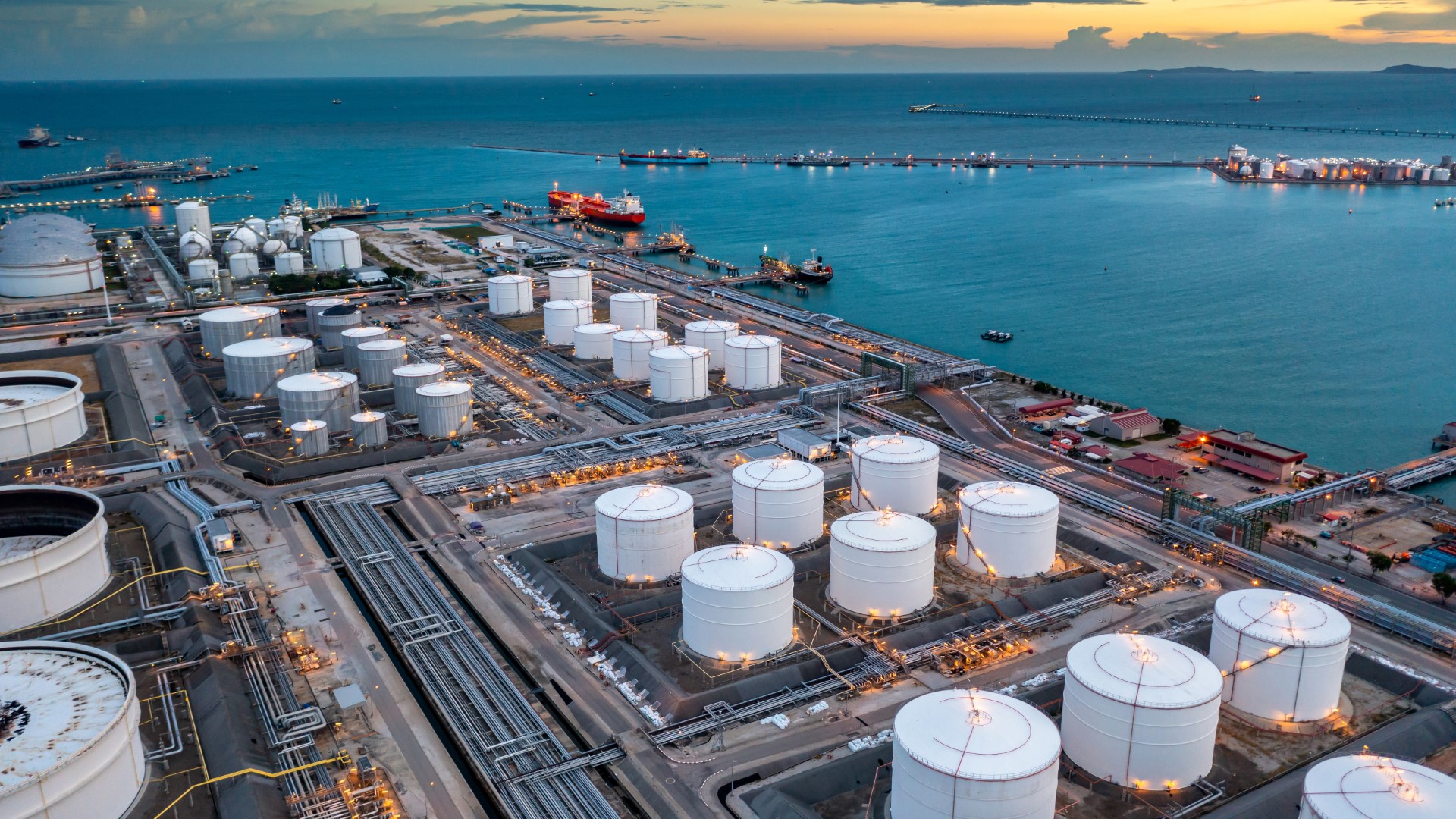 Aerial view oil terminal industrial facility storage tank oil and petrochemical product for transport to further storage facility, Storage tank petroleum petrochemical refinery product at oil terminal